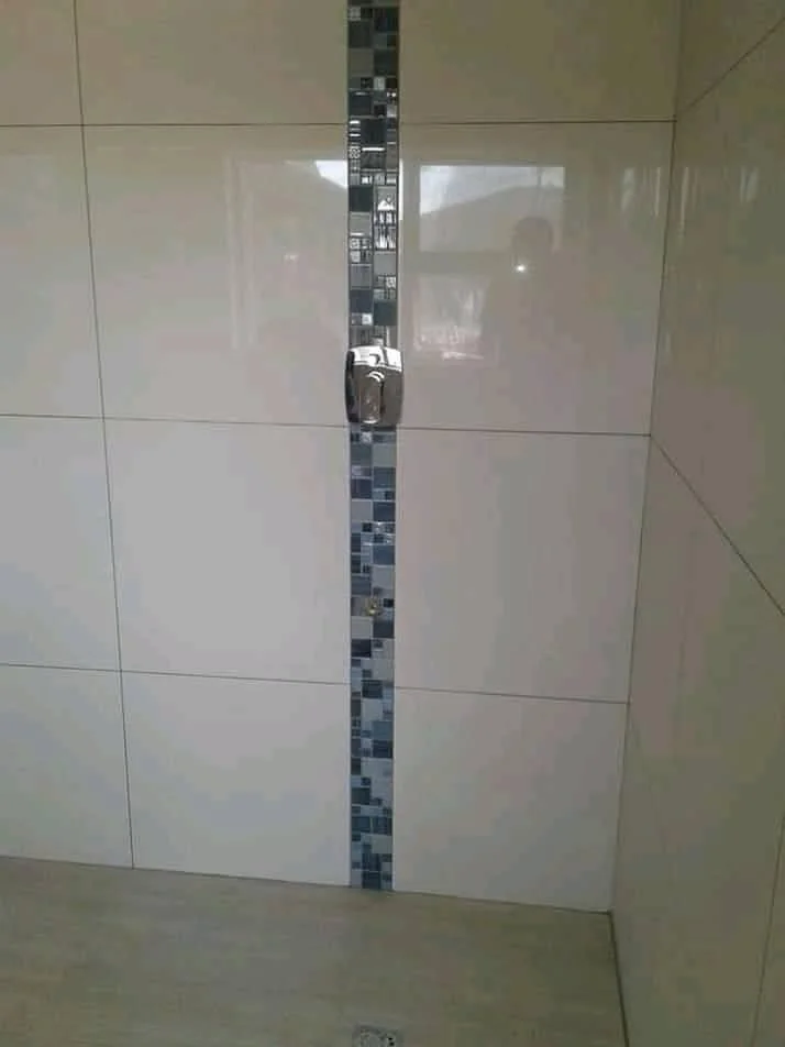 Shower area tiling and regrouting with refreshed waterproof wet-zone finish